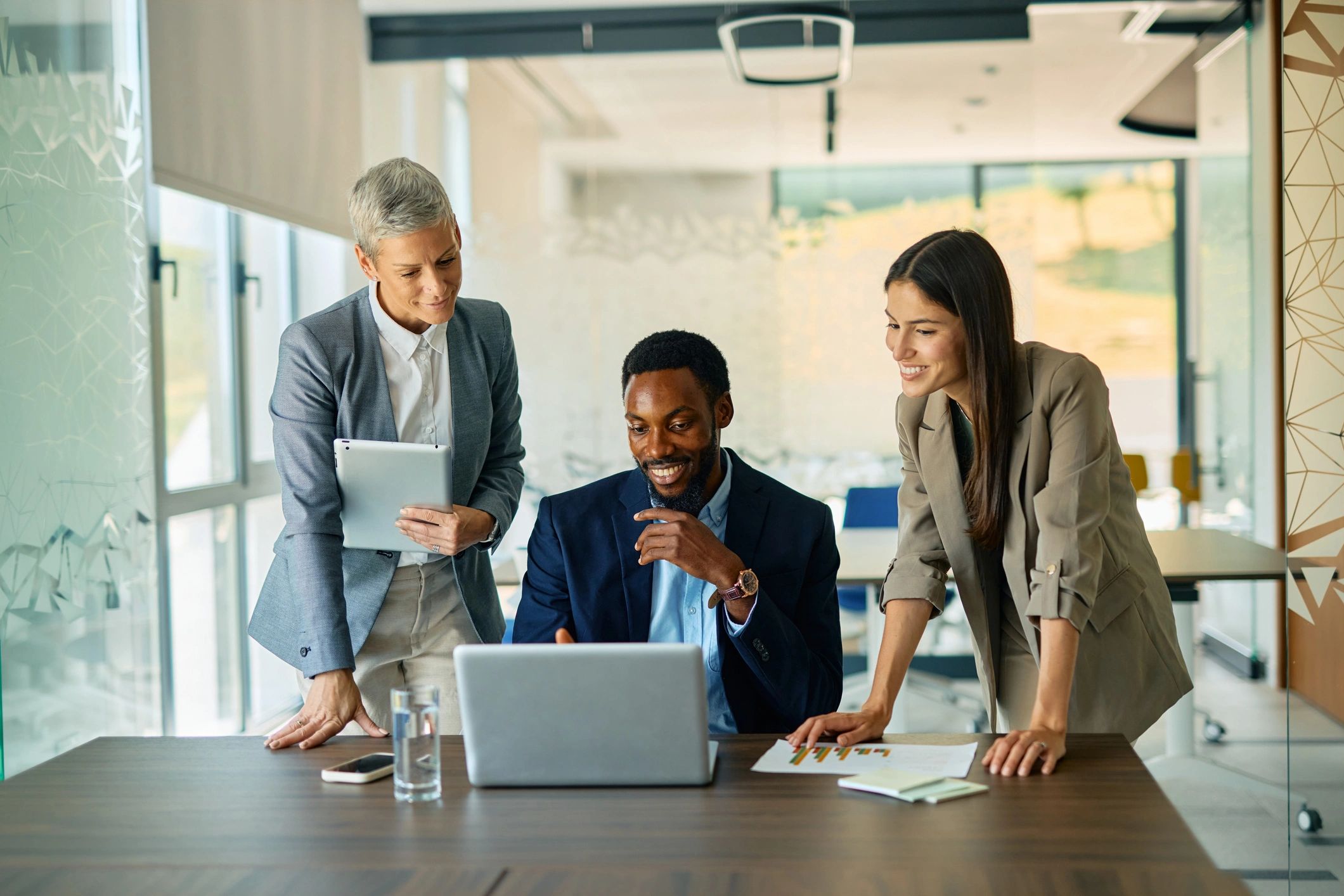 Business professionals collaborating on strategy in a modern office